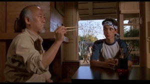 Pat Morita and Ralph Macchio in their iconic roles of Mr. Miyagi and Daniel Larusso